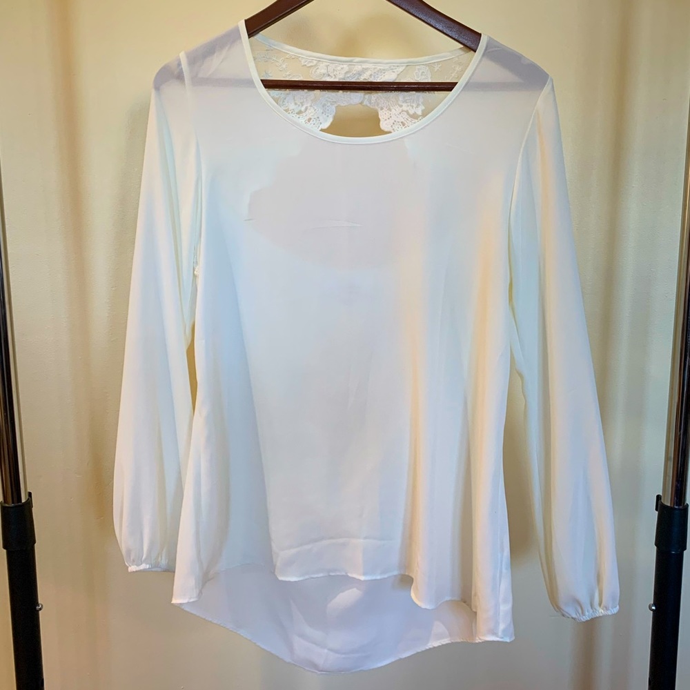 Cream blouse with lace cut out in the back
